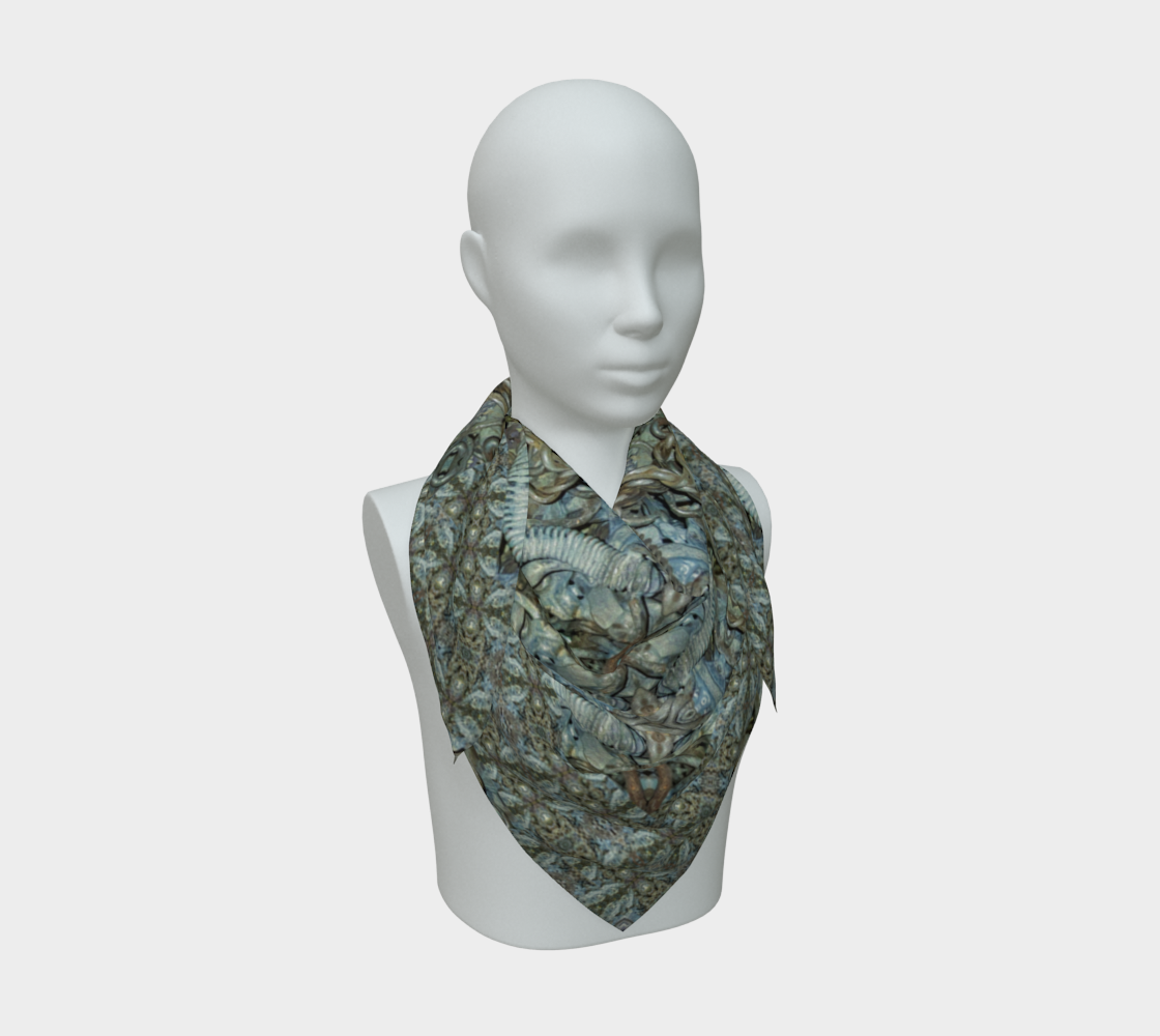 Front mannequin view of the Grail Night Hoard Virtus 8.1 Silk Art Scarf in blue-gray, slate, charcoal, bronze, olive, rust and cream, with large angular shards, loops and pointed forms interlaced around a central starburst, arranged in a compact pointed drape.