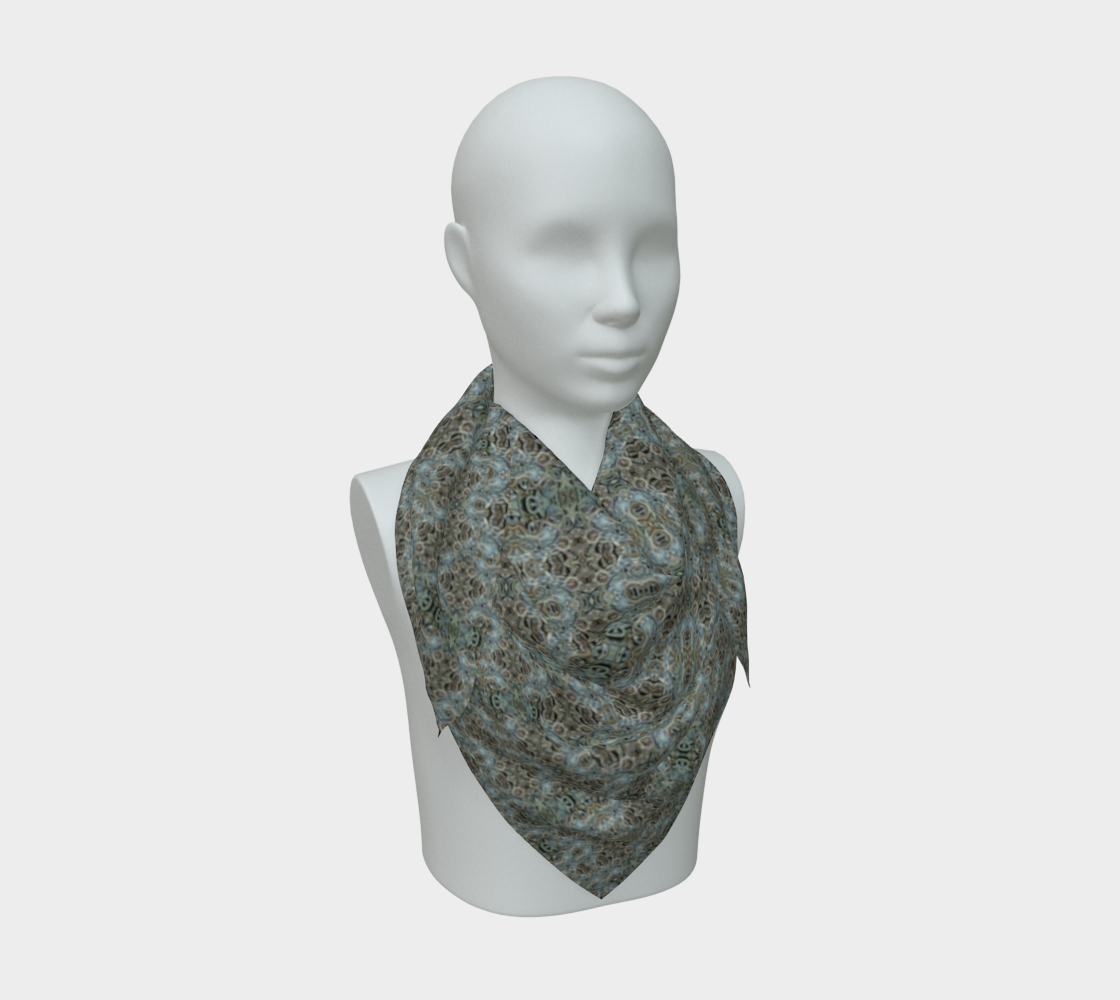 Front mannequin view of the vGrail Night Hoard Virtus 8.9 Silk Art Scarf in gray, silver gray, pale cyan, wrapped close with a centered pointed fall and small rosette and ring cells repeated at nearly one scale.
