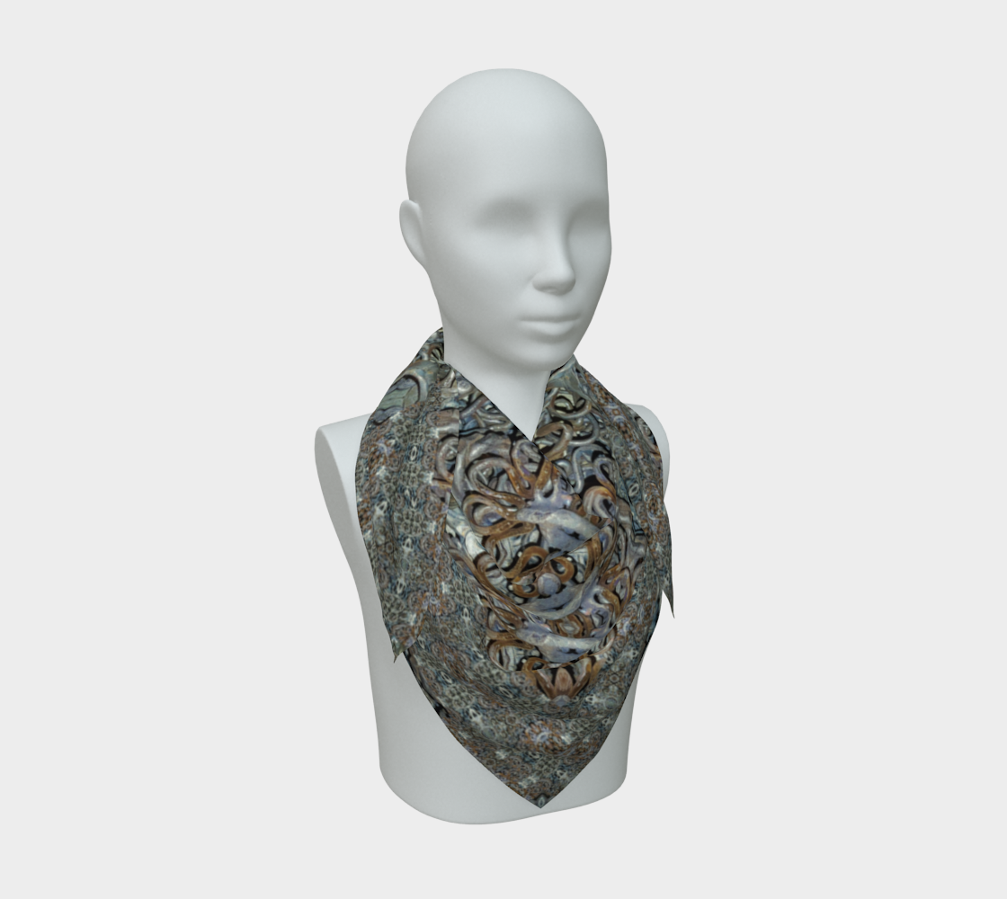 Front mannequin view of the Grail Night Hoard Virtus 8.5 Silk Art Scarf in gray, silver gray, gold, orange, wrapped close with a centered pointed fall and warm curling calligraphic medallions and loop clusters.