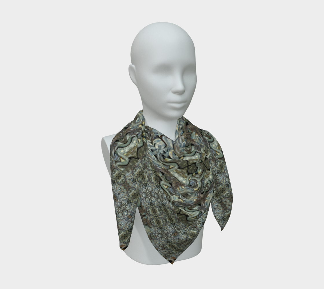 Broader mannequin drape of the Grail Night Hoard Virtus 8.2 Silk Art Scarf in blue-gray, silver-gray, olive, charcoal, rust and cream, opening repeated hourglass, oval and scroll units arranged in mirrored vertical bands across layered folds and multiple pointed ends.