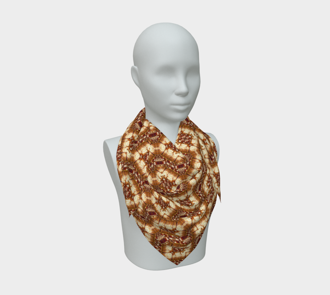 Front mannequin view of Copper Zigzag Diamond Weave Silk Art Scarf, with copper-and-cream diamonds gathered into a looped pointed drape.